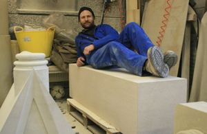 Matt Barton, Salisbury Cathedral stonemason, with the block of stone to be carved